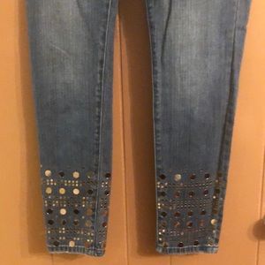 Michael Kors ankle length jeans with mirror embellishments on the lower legs.